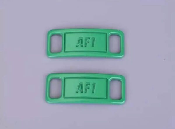 Green shoelace buckle